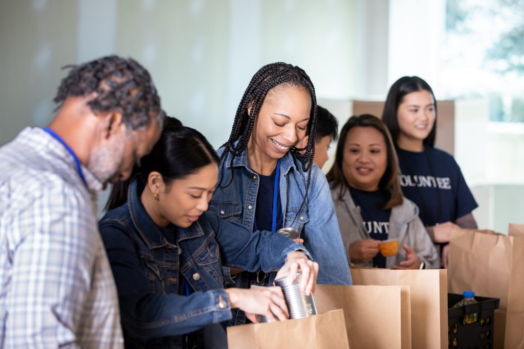 Volunteers preparing food bags as part of emergency support for food access partners.