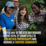 Diverse group volunteering with a headline announcement